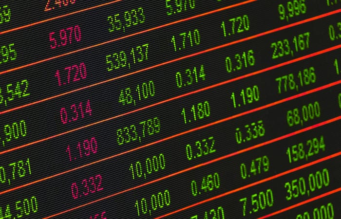 This is an image of a blackboard with dynamic pricing figures in colors