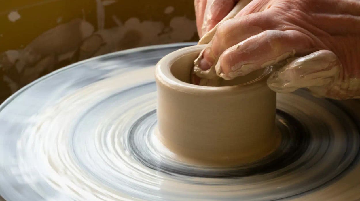 Picture of a hand making pottery