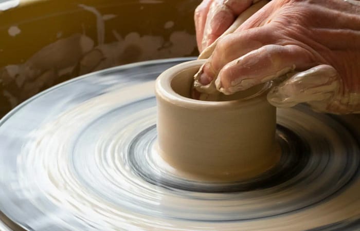 Picture of a hand making pottery